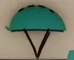 Teal helmet with black straps on the Bike Hub wall.