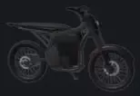 Black EX1 electric dirt bike in side view.